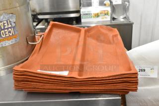 20 orange Silform 2 loaf baking pan liners, stack of new liners, durable silicone-coated fabric, auction lot indicated.