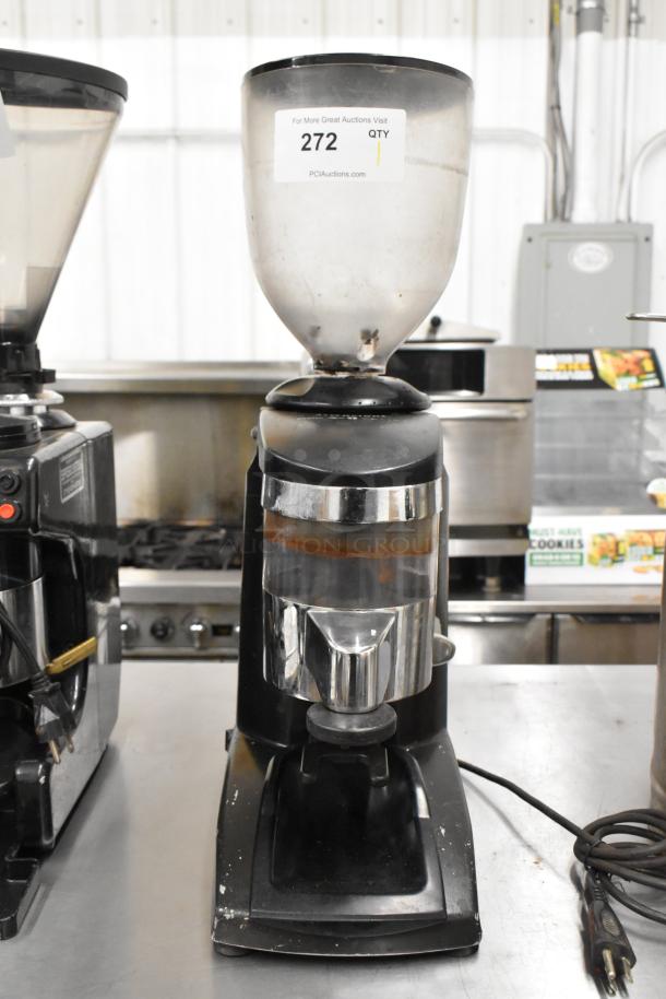 Metal commercial countertop espresso bean grinder, 115 volts, 1 phase. Features hopper and dispensing spout. Used condition.