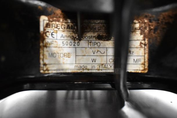 Bregani metal countertop espresso bean grinder label, showing model and voltage details, worn condition, made in Italy.