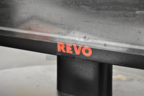 Revo monitor with visible logo, paired with metal cash drawer. Gently used condition, ideal for retail setups.