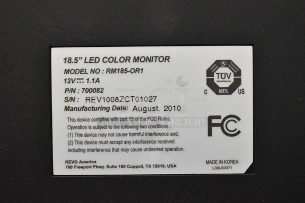 Revo 18.5" LED monitor, model RM185-OR1, 12V, 1.1A, P/N 700082, S/N REV1008ZCT01027, manufactured August 2010, with TUV and FCC labels.