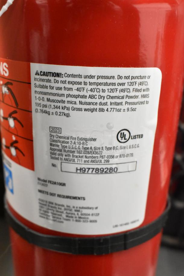 Red fire extinguisher with label showing UL listing, dry chemical type, model FE2A10GR, suitable for ABC fires.