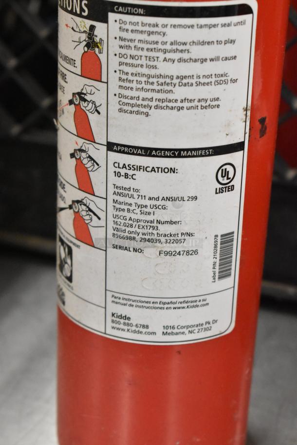 Five Kidde fire extinguishers, model 10-B:C, UL listed, safety and usage instructions on label, buyer pick-up only.