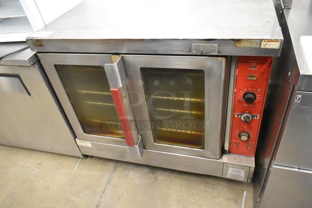 Vulcan stainless steel commercial convection oven with view-through doors, metal racks, and thermostatic controls.