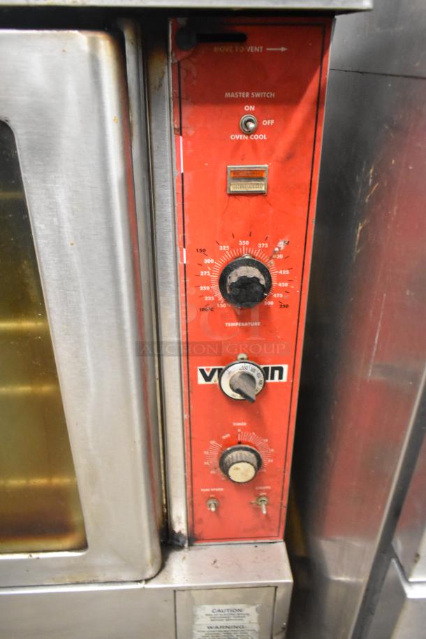 Vulcan stainless steel commercial convection oven with view-through doors, metal racks, and thermostatic controls.