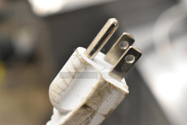 Close-up of a plug end showing dirt and wear; part of the 2019 Accucold ARG3PV Metal Mini Cooler Merchandiser, 115 Volts.
