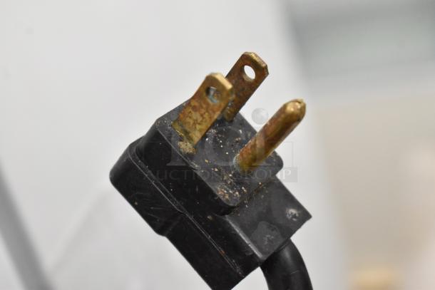 Close-up of a power plug from a True TUC-48F-LP Stainless Steel 2 Door Undercounter Freezer. 115 Volts, 1 Phase.