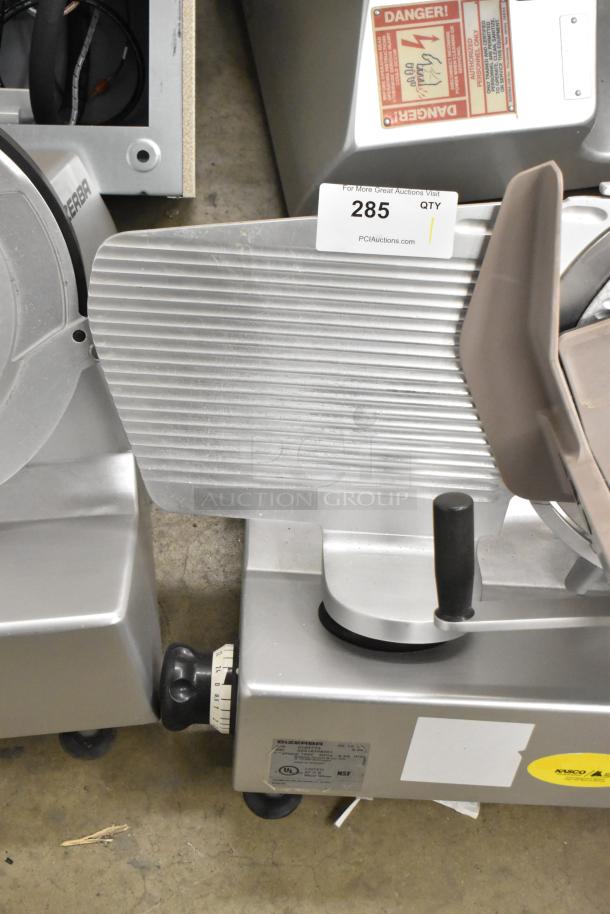 Bizerba SE 12 US metal commercial meat slicer, 120 volts, 1 phase, in good condition with visible safety warning labels.