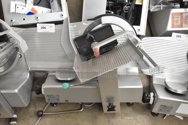 2017 Bizerba GSP H metal countertop meat slicer, 120 volts, 1 phase, excellent condition, with adjustment knobs and safety labels.