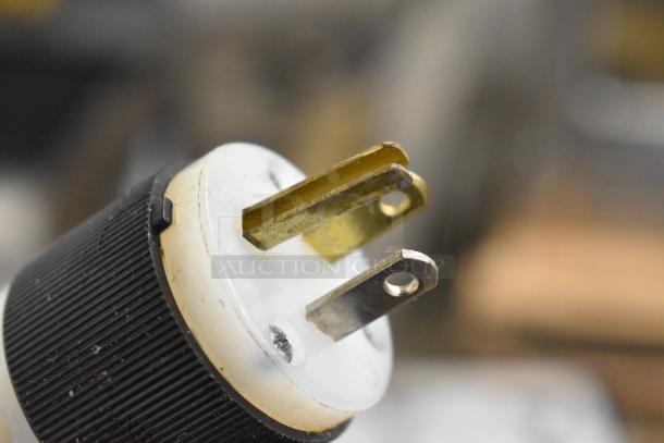 Alt text: Close-up of a plug for a 2017 Bizerba GSP H meat slicer, showing prongs for 120 Volts, 1 Phase connection.