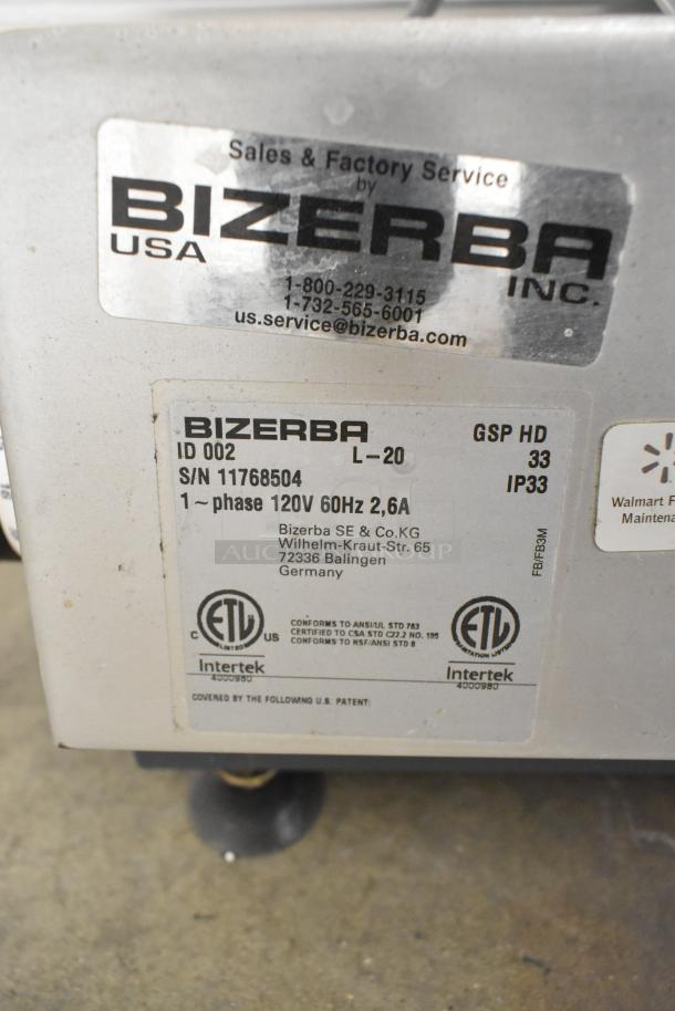 2020 Bizerba GSP HD commercial meat slicer label, 120V, 1 phase, serial number 11768504, compliance certifications visible.