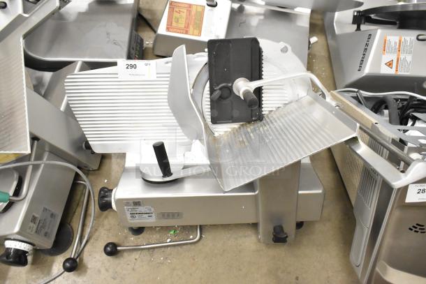 Bizerba SE 12 US commercial meat slicer, metal, countertop model in used condition, 120 volts, 1 phase, visible safety markings.