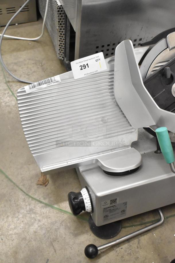 2016 Bizerba GSP H metal commercial meat slicer, 120 volts, 1 phase, good condition, auction tag 291 visible.