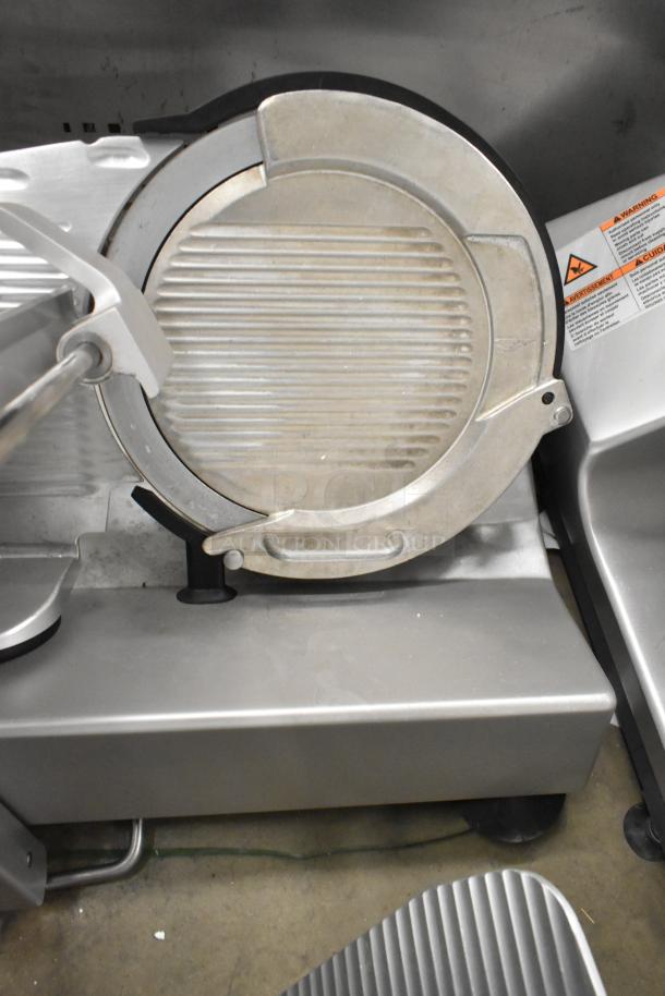 2016 Bizerba GSP H countertop meat slicer, metal, 120 volts, 1 phase. Good condition, visible safety and usage labels.