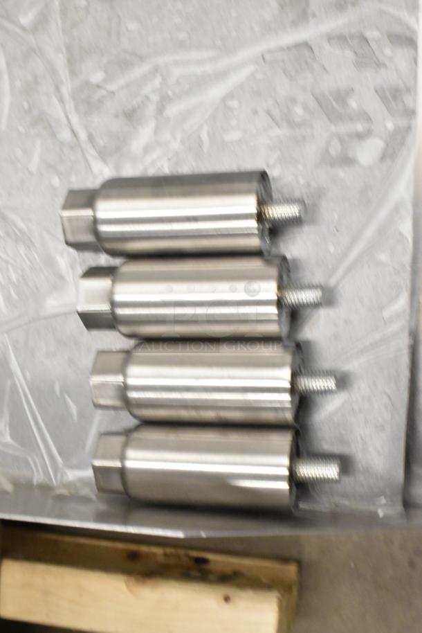Four stainless steel adjustable legs for Avantco 177EG24N griddle. New condition, supports countertop stability.