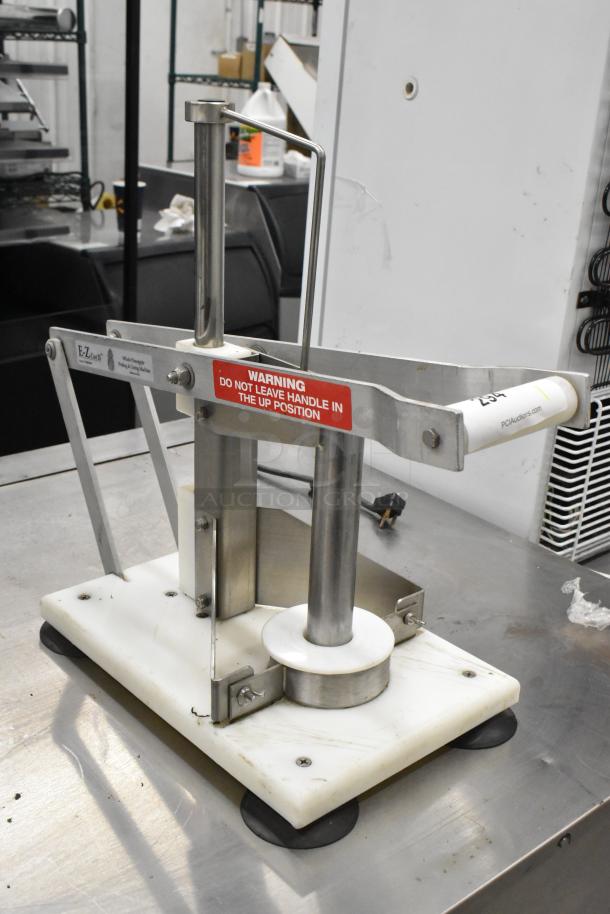 E-Z Cut II Metal Countertop Pineapple Corer with white base, stainless steel parts, and safety warning label. Good condition.