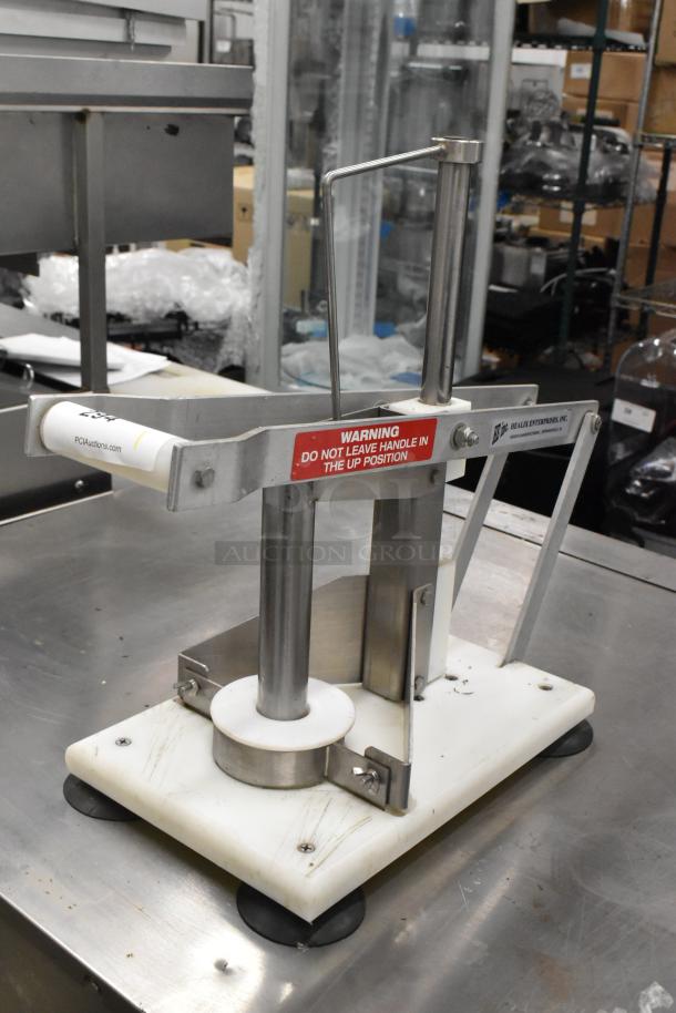 E-Z Cut II Metal Countertop Pineapple Corer, stainless steel, sturdy base, good condition, safety label visible.