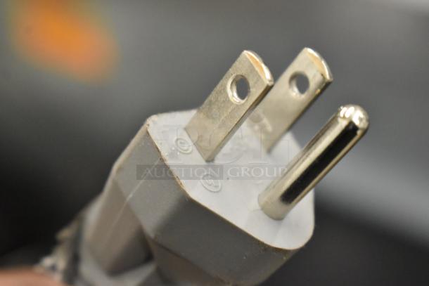 Close-up of a plug on the 2024 Hamilton Beach countertop microwave, model HB8436193153-03, 120V, 1-phase.