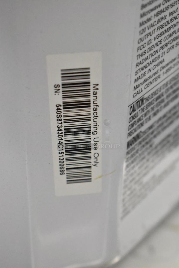 2024 Hamilton Beach HB8436193153-03 Countertop Microwave Oven label, includes serial number details.