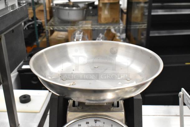Two metal countertop scales including Yamato SM(N) and Marco SW10211, in used condition. Large weighing pan and clear dial markings.
