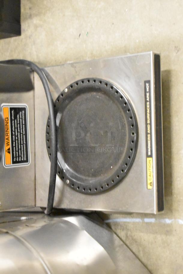 Bunn CWTF15 stainless steel coffee machine burner, caution and warning labels visible, in used condition.