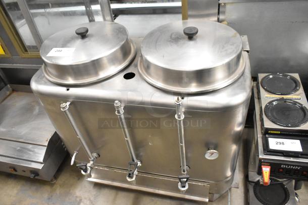 Stainless steel commercial countertop double automatic coffee urn with dual lids, spigots, and a temperature gauge.