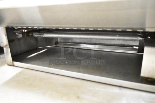 Stainless steel interior of a commercial countertop double automatic coffee urn, showing its sturdy construction and clean surface.