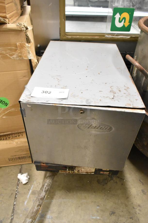 Hatco C-12 Metal Commercial Hot Water Booster Heater, shows wear with visible scratches and some rust, model marked on front.