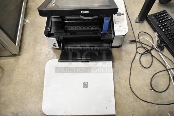 Canon K10339 printer open with visible control panel, power cords, and keyboard nearby; used condition.
