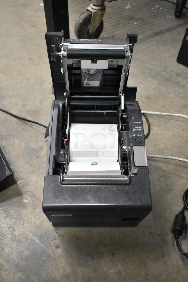 Epson receipt printer with open paper compartment, showing internal rollers and error, paper out, feed buttons.