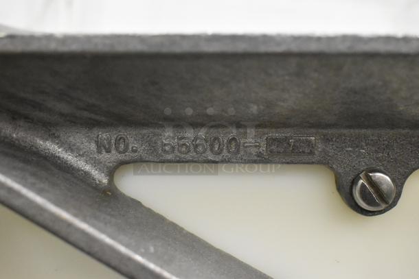 Nemco Metal Countertop Tomato Slicer, model No. 55600, visible marking. Sturdy metal construction, used condition.