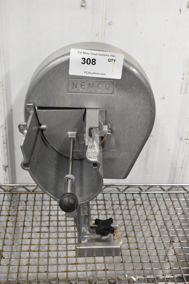 Nemco Metal Countertop Vegetable Slicer in used condition, featuring a sturdy metal frame and labeled with "Nemco."