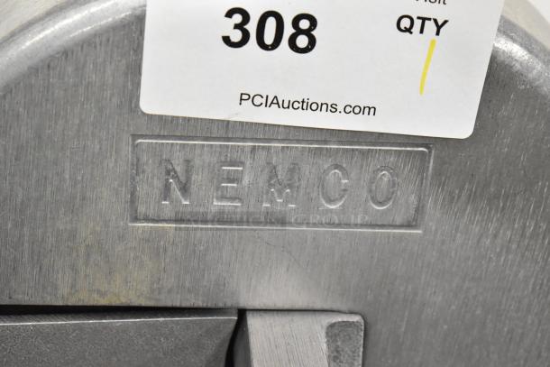 Nemco metal countertop vegetable slicer with embossed brand name and auction label. Ideal for efficient slicing tasks.