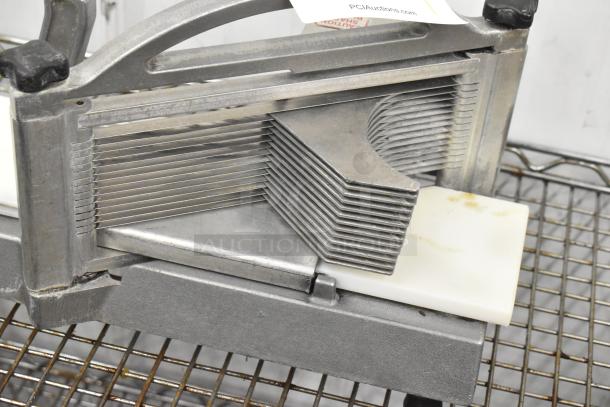 Nemco 56600 Metal Countertop Tomato Slicer, featuring multiple parallel blades, sturdy metal frame, used condition.