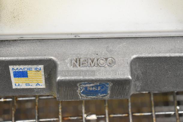 Nemco 56600 Metal Countertop Tomato Slicer, featuring "Made in USA" and NSF certification labels, used condition.