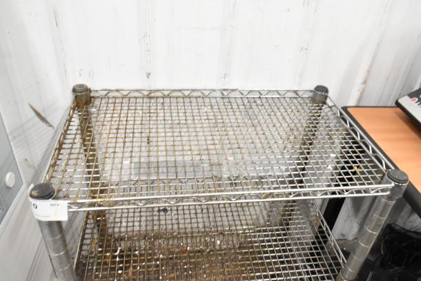 Chrome finish 3-tier wire cart with commercial casters, in used condition. Ideal for storage and organization.