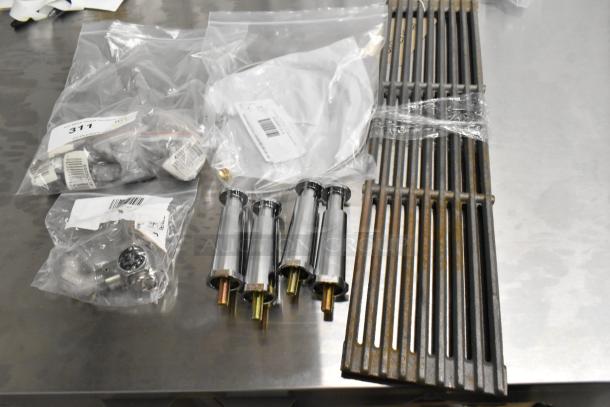 8 brand new scratch and dent items including American Range A17010 grate, Imperial Range 40499 kit, and Henny Penny 59742 valve.