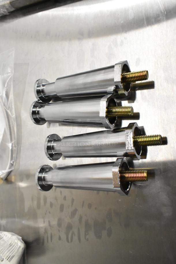 Set of shiny stainless steel rods with threaded ends, lined on metallic surface. Part of a scratch and dent auction lot.