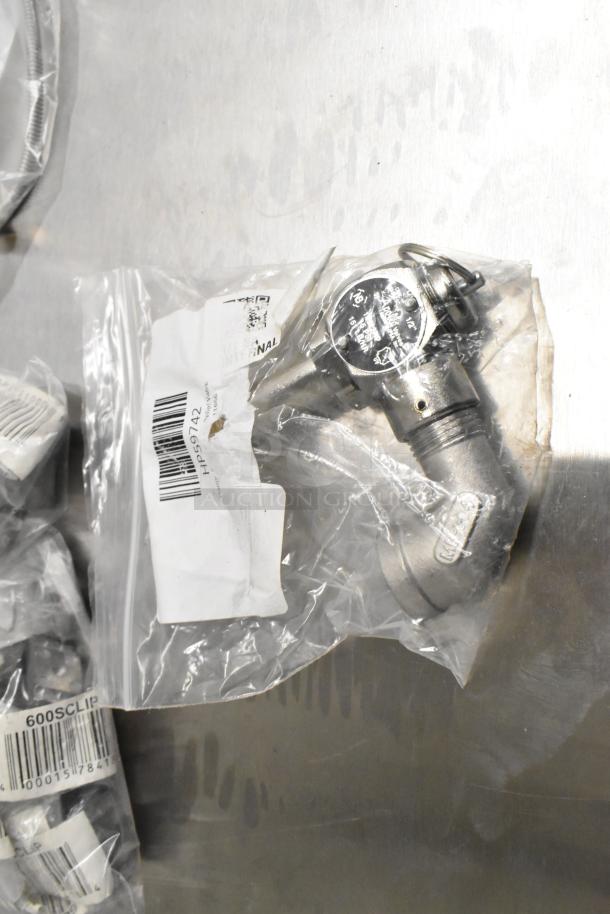 Eight new scratch and dent items, including American Range A17010 grate and Henny Penny HP59742 relief valve, in original packaging.