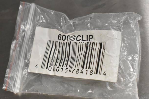 Bag with barcode and "600SCLIP" label visible, item condition unclear.