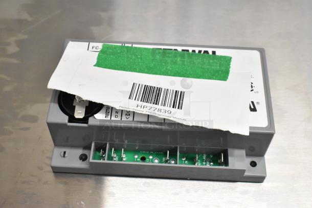 Henny Penny 77839 Ignition Module, brand new, labeled HP77839, shown with partially visible packaging.