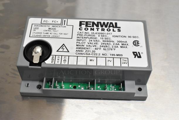 Henny Penny ignition module HP77839, new condition, detailed label with specifications and diagnostic indicators visible.