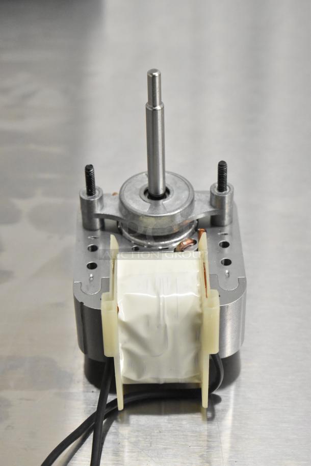 Brand new Henny Penny 80821 Blower Motor, part of a scratch and dent auction set, visible wiring and metal components.