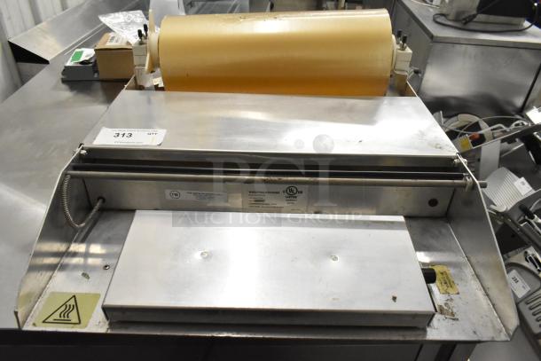2016 Metal Countertop Wrapping Station, Model 5000156, 115 Volts, 1 Phase, visible UL label, stainless steel with heating element.