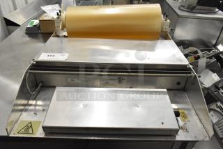 2016 Metal Countertop Wrapping Station, Model 5000156, 115 Volts, 1 Phase, visible UL label, stainless steel with heating element.