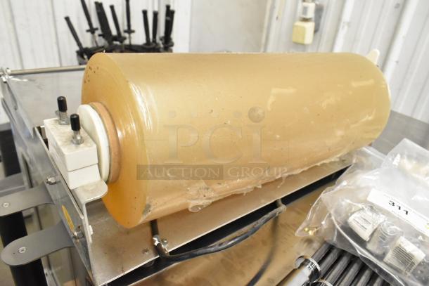 2016 5000156 Metal Countertop Wrapping Station, 115 Volts, 1 Phase, features a large plastic roll.