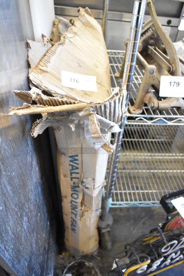 Boltic 30" wall-mounted fan, model 73AVF30WLFO, 2-speed, 6,750-8,100 CFM, in damaged packaging.