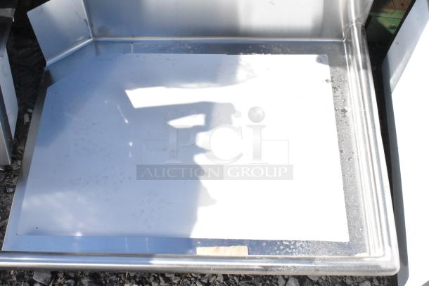 Brand new Regency 600CDT36R 16 Gauge 3' clean dish table with right drainboard. Scratch and dent condition. No legs.