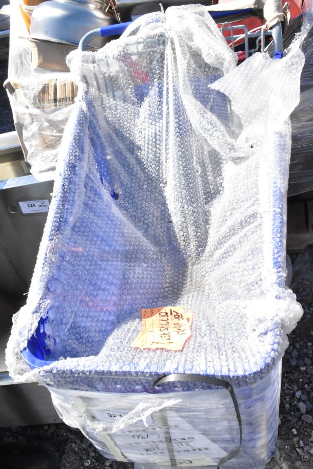 BRAND NEW SCRATCH AND DENT! 460PSHPCRTL58 Regency Blue Plastic Grocery Cart, 5.8 Cu. Ft., wrapped in bubble wrap.