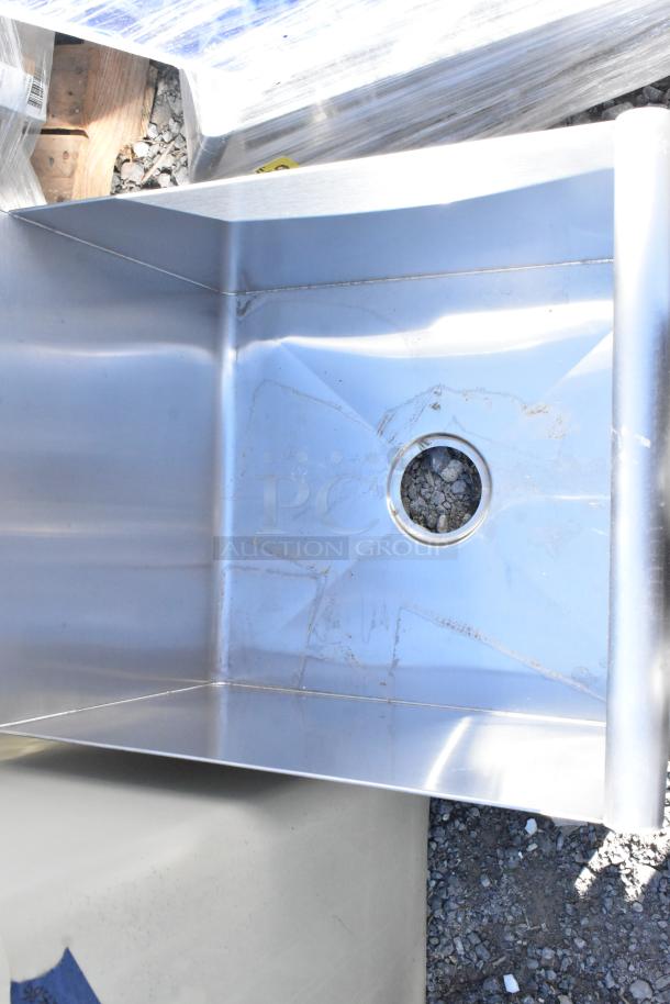 Stainless steel single bay sink, scratch and dent condition, new, no legs included, visible drain opening.